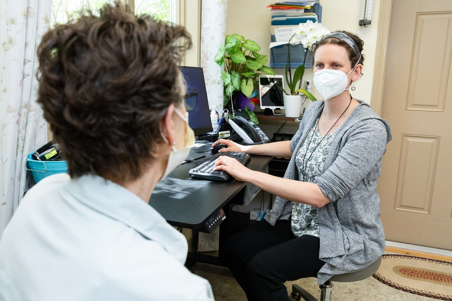 Medical professional working with a client