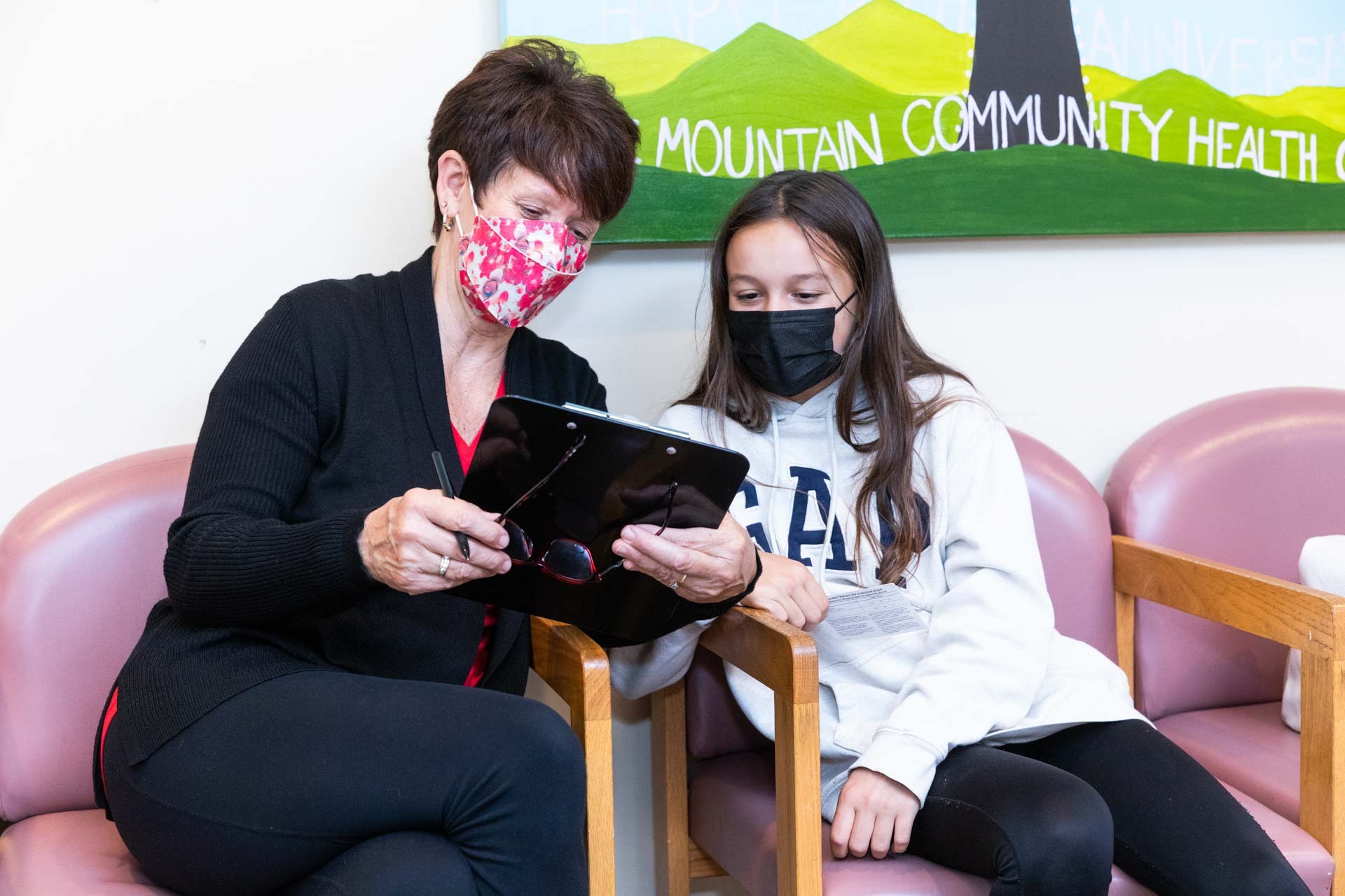 Showing charts to young patient