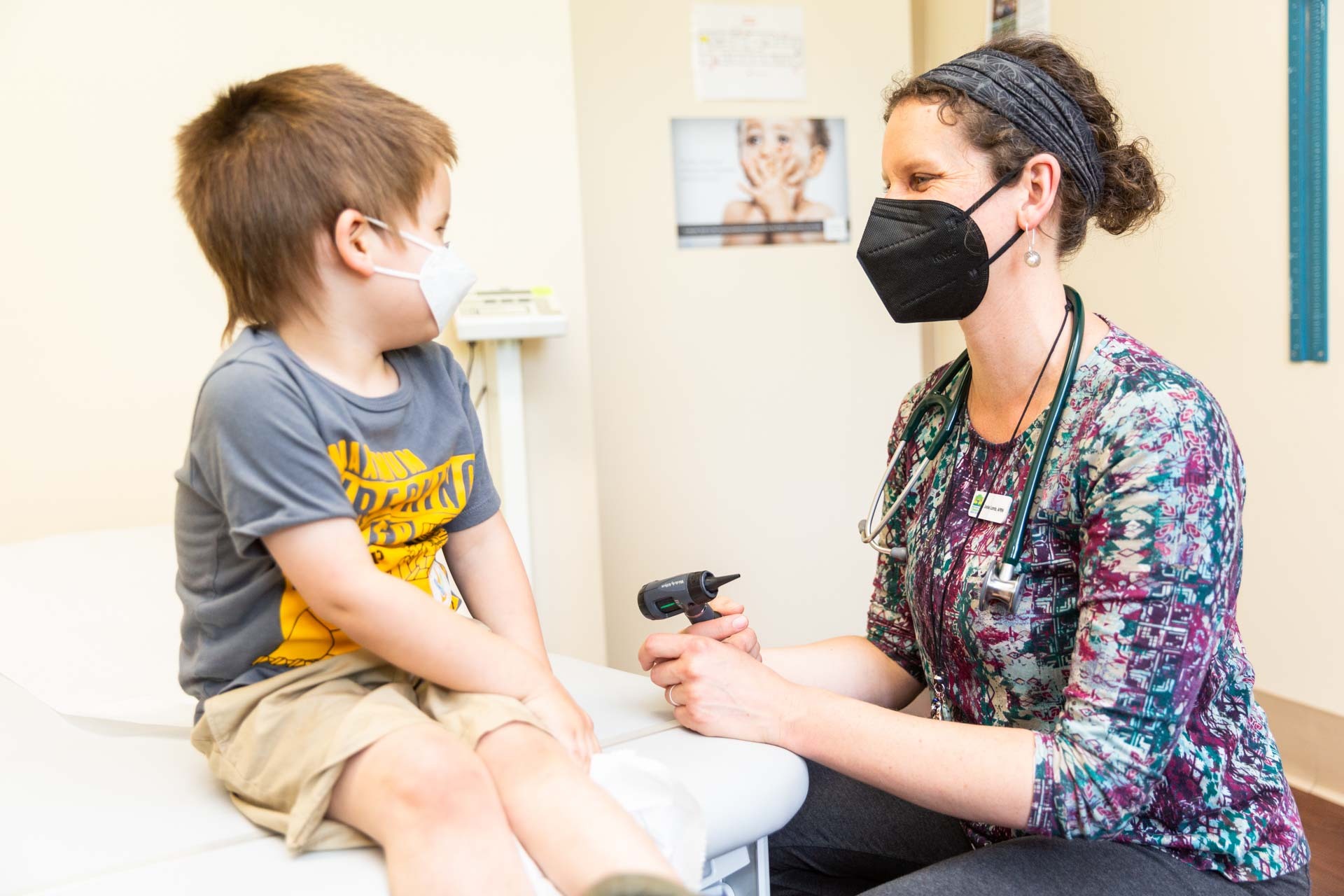 Pediatrician working with patient