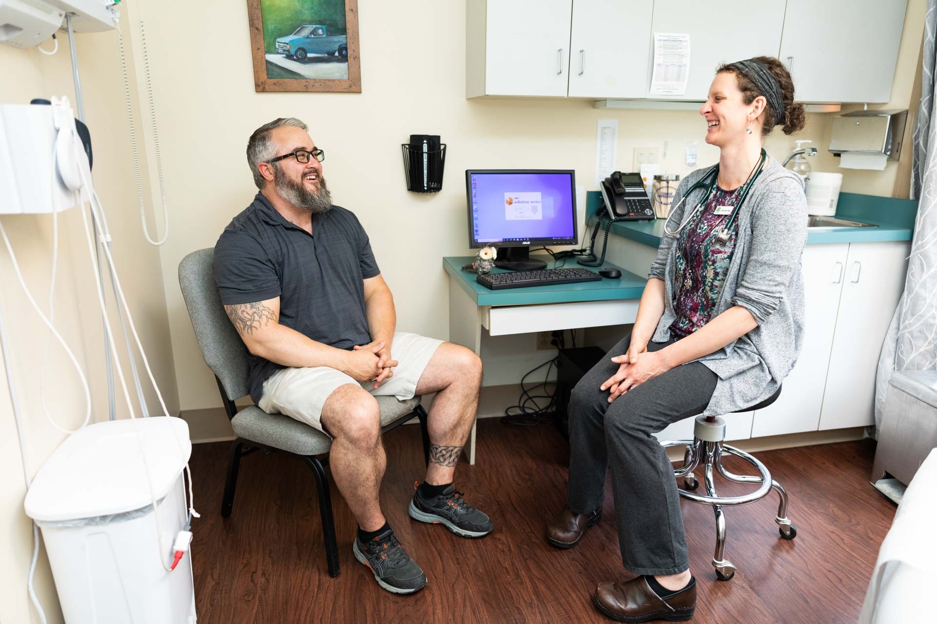 Patient and medical professional sit and discuss